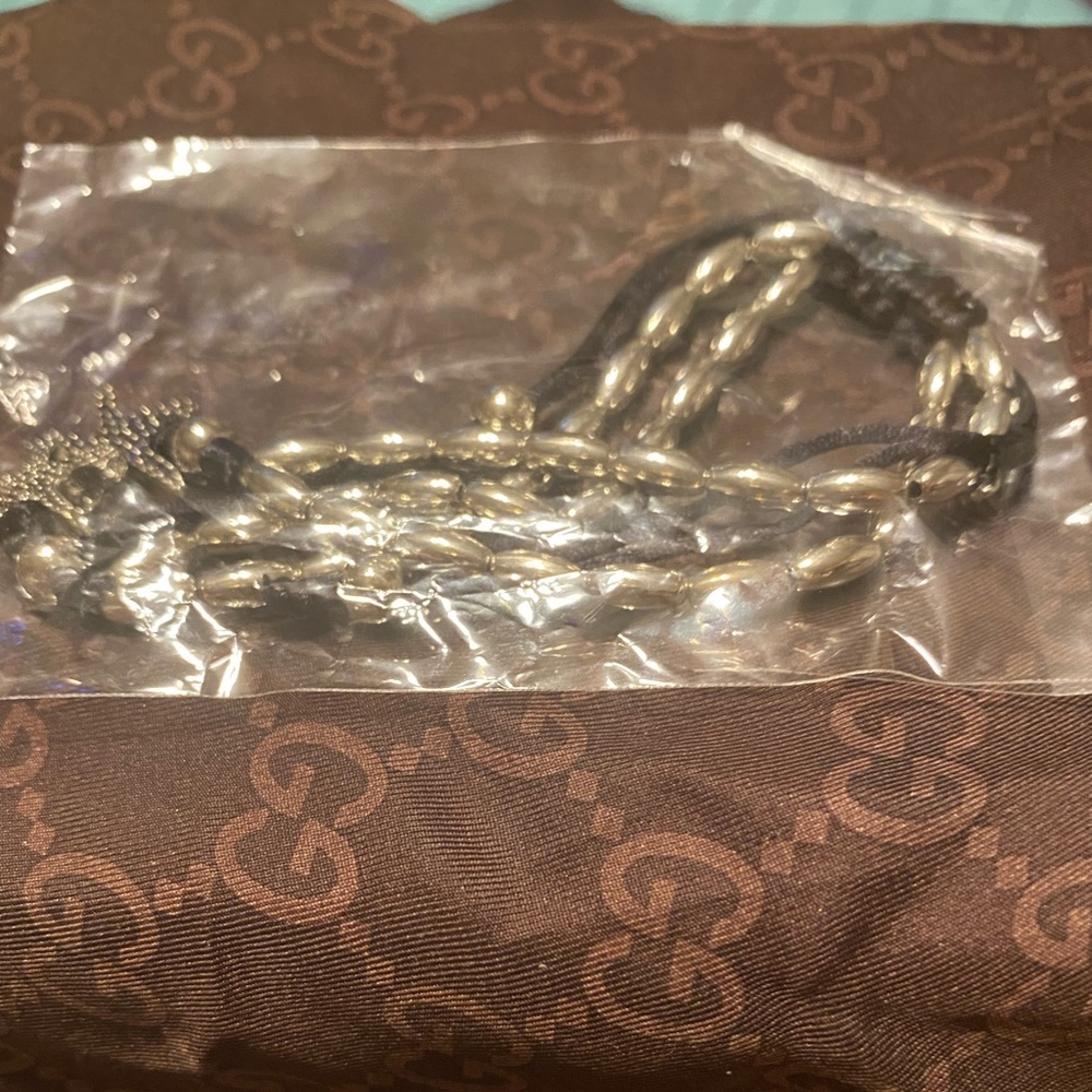 Ankle bracelet, double string, silver, with charm and balls.